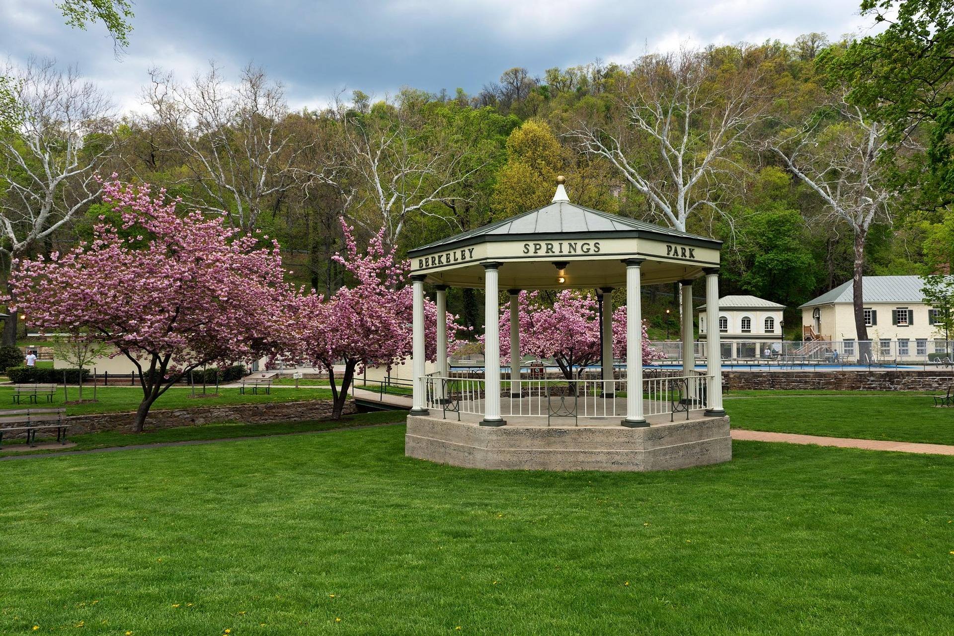 The spring pavilion and gazebo at Berkeley Springs State Park, West Virginia, with cherry trees in bloom