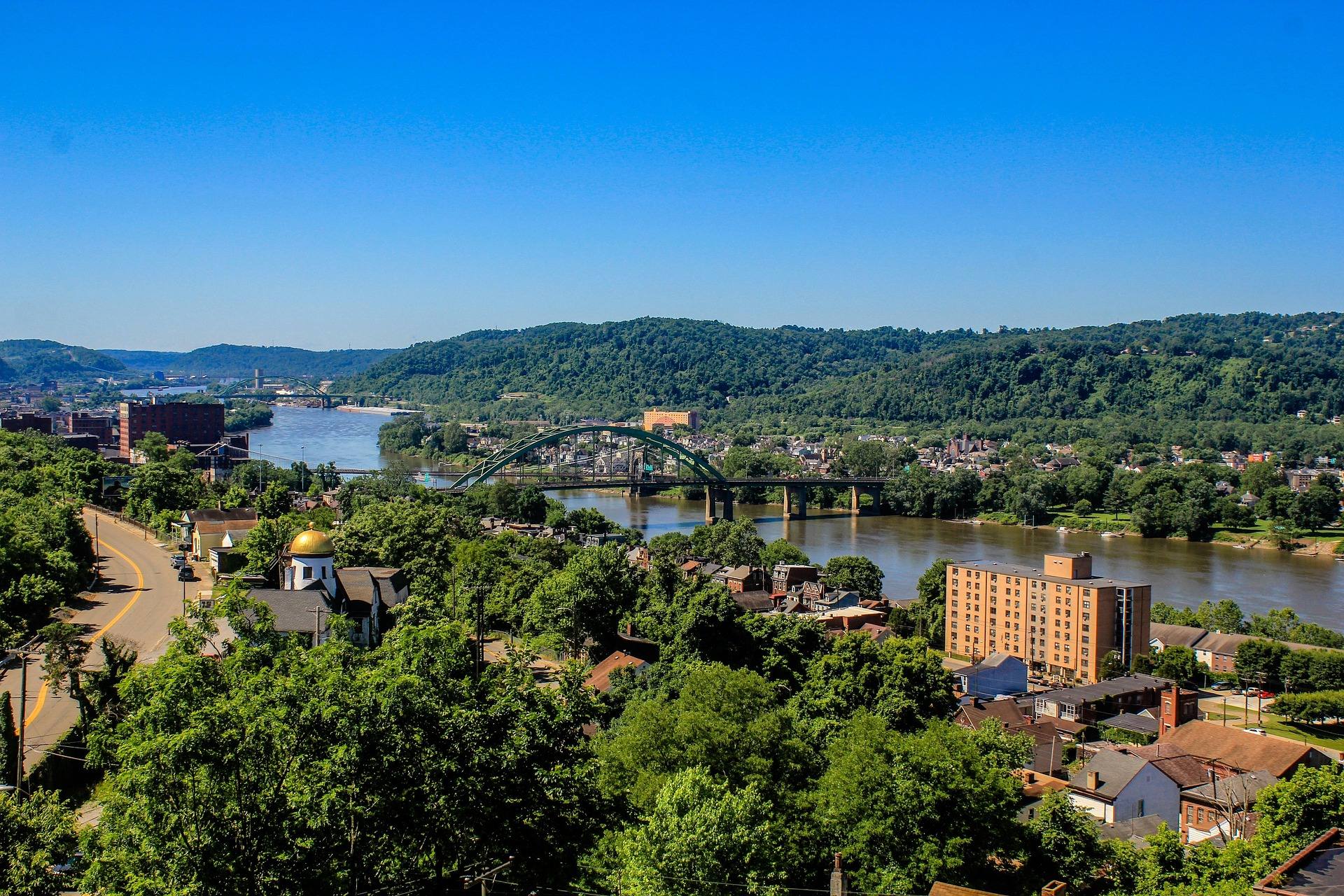 Hillside view over Wheeling, West Virginia, with the Ohio River and the historic Wheeling Suspension Bridge